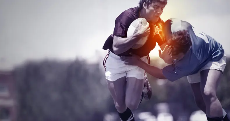 A rugby player injuring his shoulder.