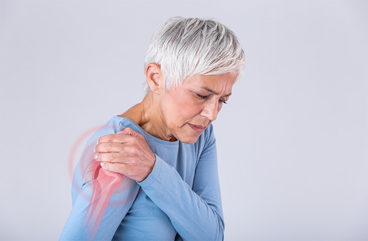 A senior woman experiencing a shoulder pain